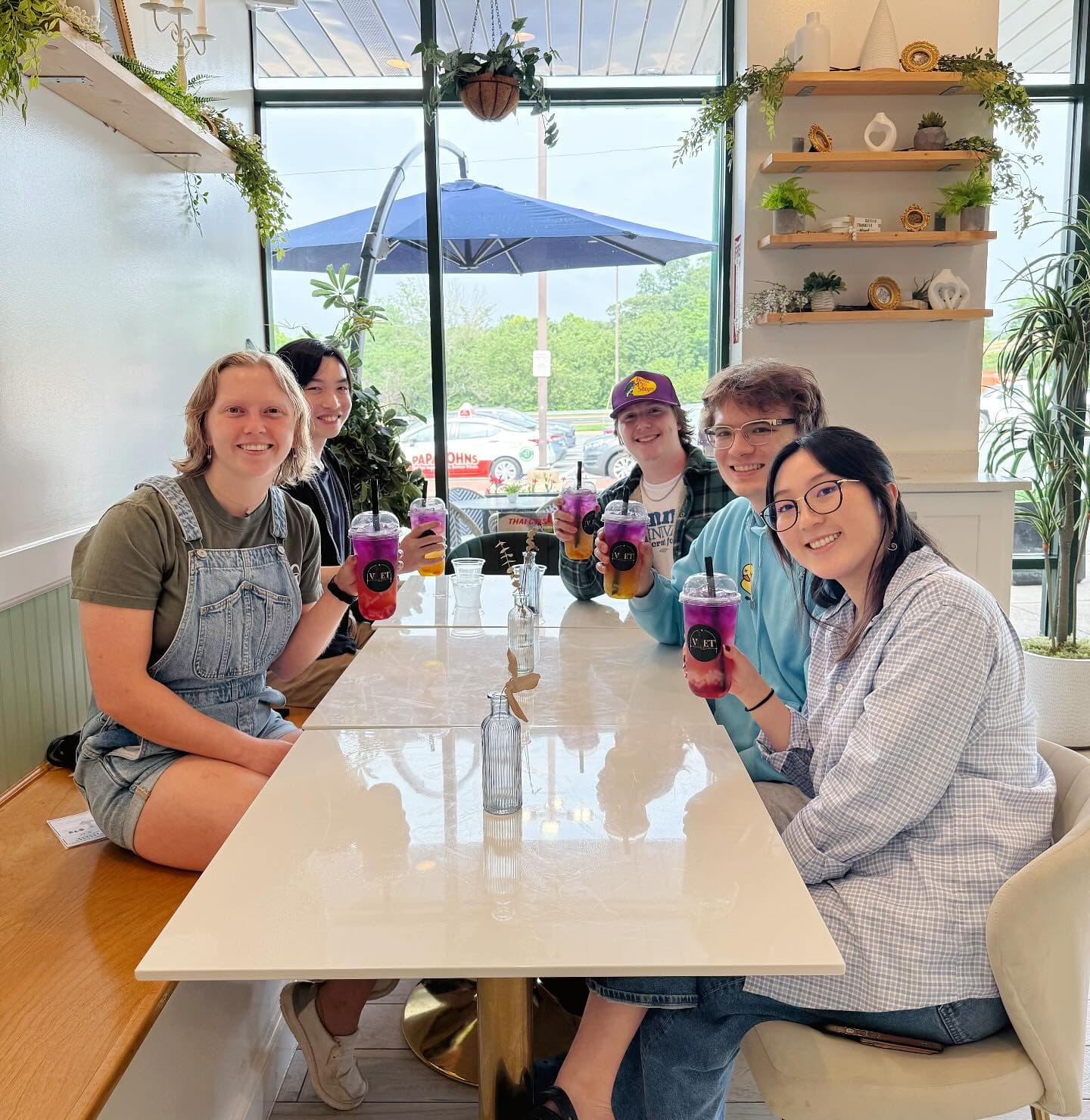 Happy customers dining inside the cafe
